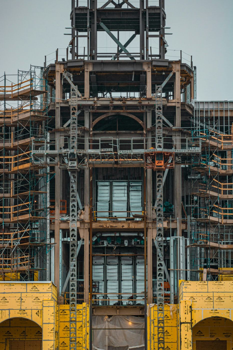 Steel frame, scaffolding and sheathing on a building under construction