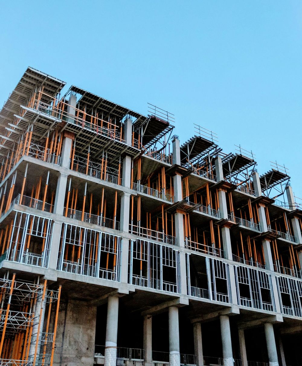 Multi-storey concrete frame with props, columns and steel studwork